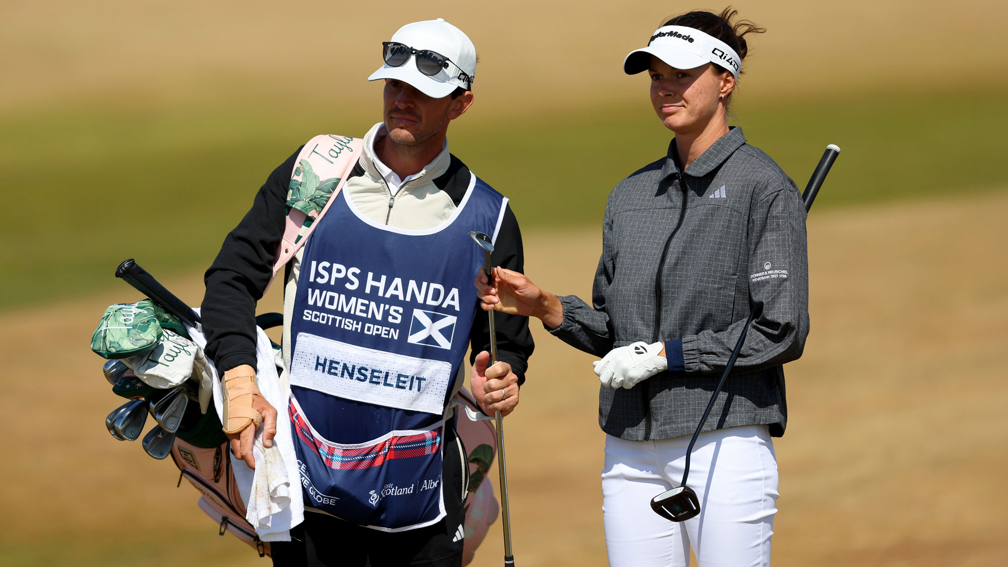 Esther Henseleit of Germany and caddie prepare for a shot during the first round of the ISPS HANDA Women's Scottish Open 2026 at Dundonald Links Golf Course on July 23, 2026 in Troon, Scotland.